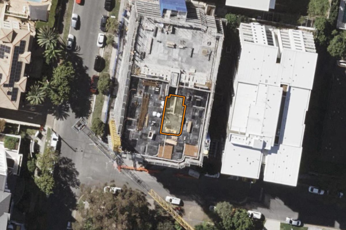 Aerial photo of 1/15 Waverley Street, Southport QLD 4215 with the lot boundary outlined in amber