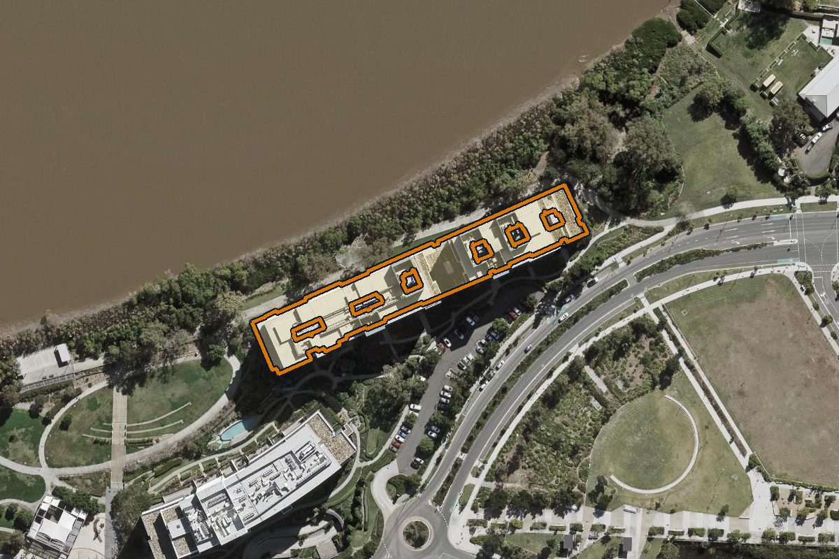 Aerial photo of 101/205 King Arthur Terrace, Tennyson QLD 4105 with the lot boundary outlined in amber
