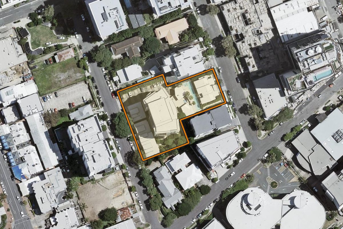 Aerial photo of 1082/18 Manning Street, Milton QLD 4064 with the lot boundary outlined in amber