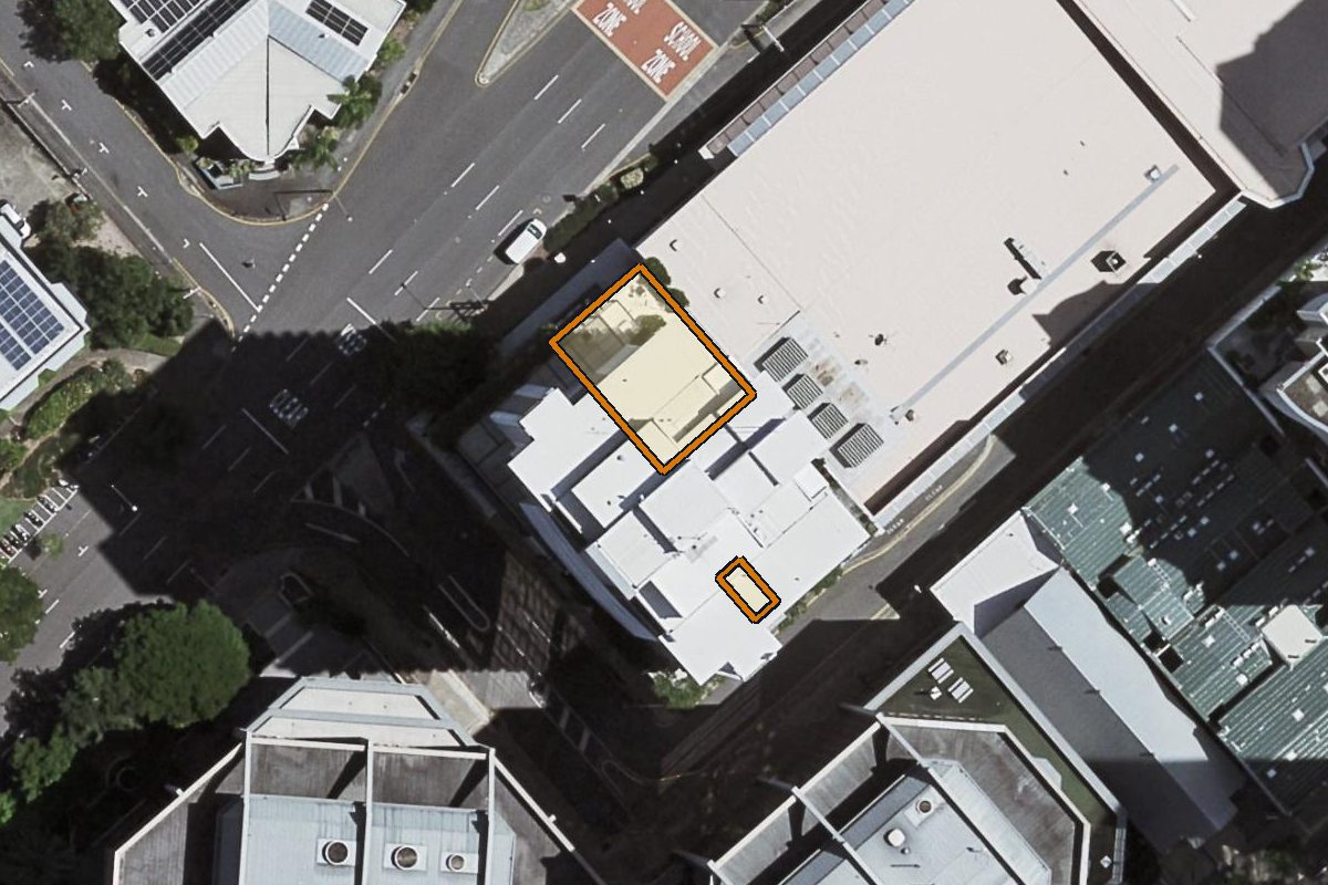 Aerial photo of 1402/361 Turbot Street, Spring Hill QLD 4000 with the lot boundary outlined in amber